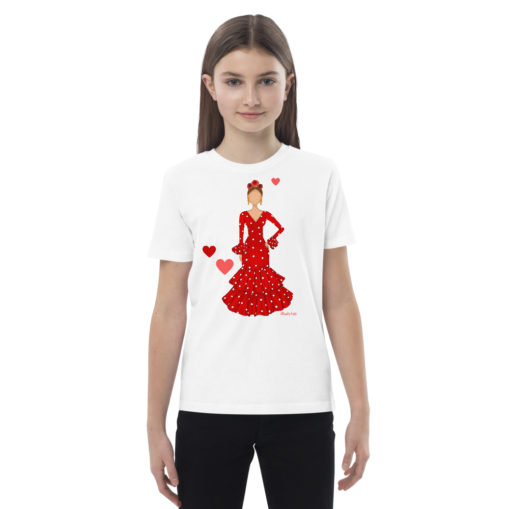 Camiseta flamenca de niñas de algodón 100% orgánico - Modelo Ana, imagen de una niña posando con una camiseta blanca que muestra el diseño flamenco.