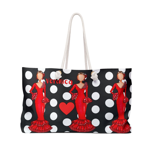 a black and white polka dot bag with a woman in a red dress