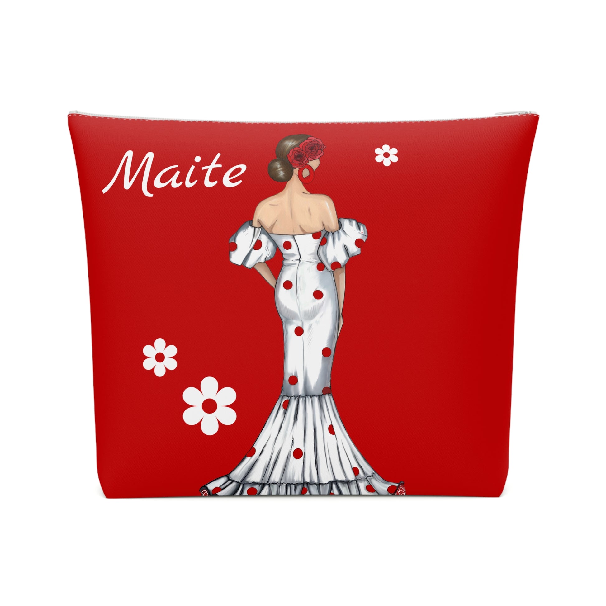 a red pillow with a picture of a woman in a dress