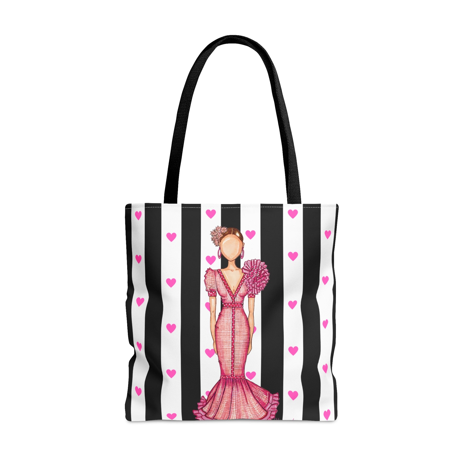 a black and white striped bag with a woman in a pink dress