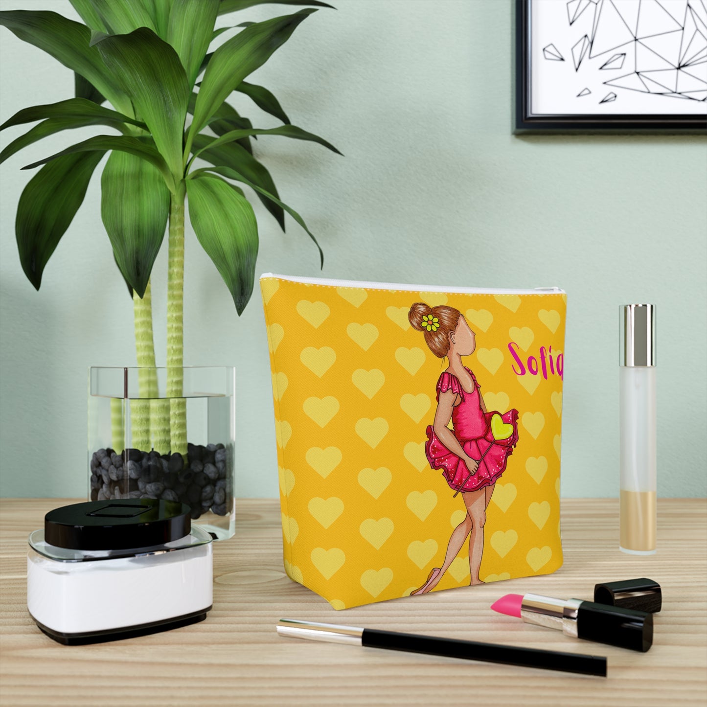 a makeup bag sitting on top of a table next to a potted plant