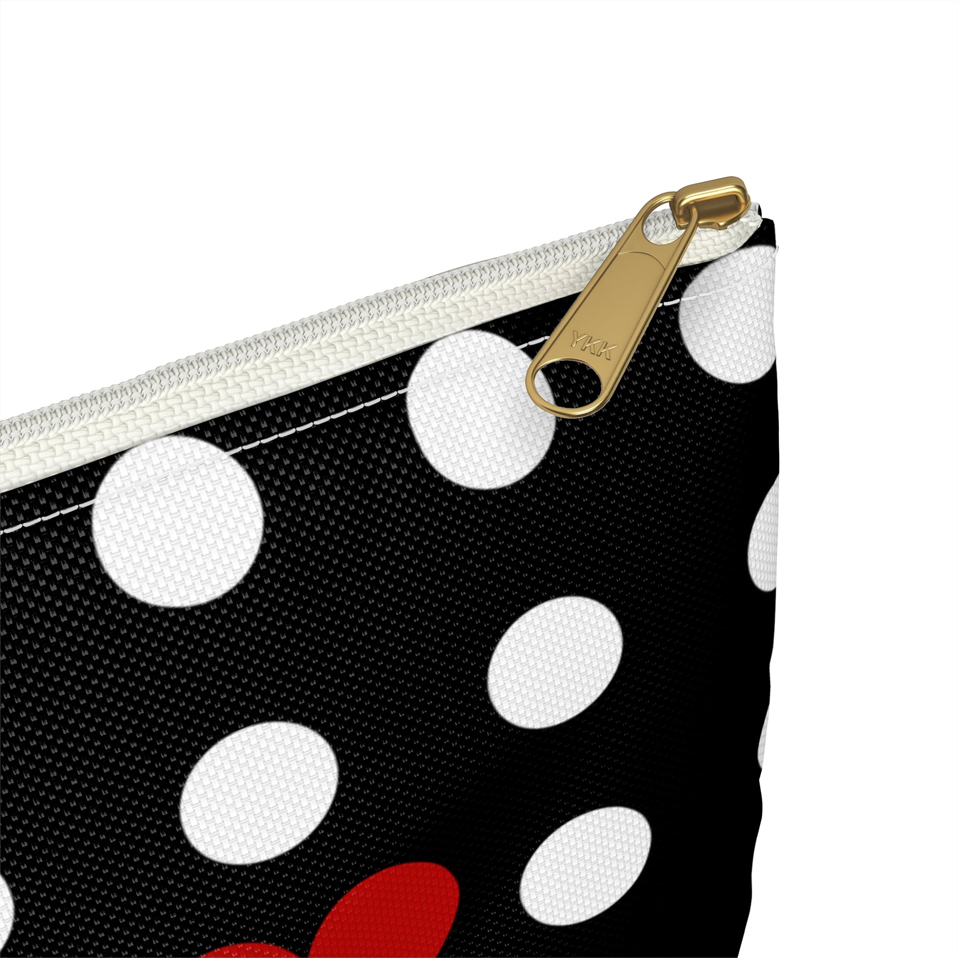 a black and white polka dot purse with red and white polka dots