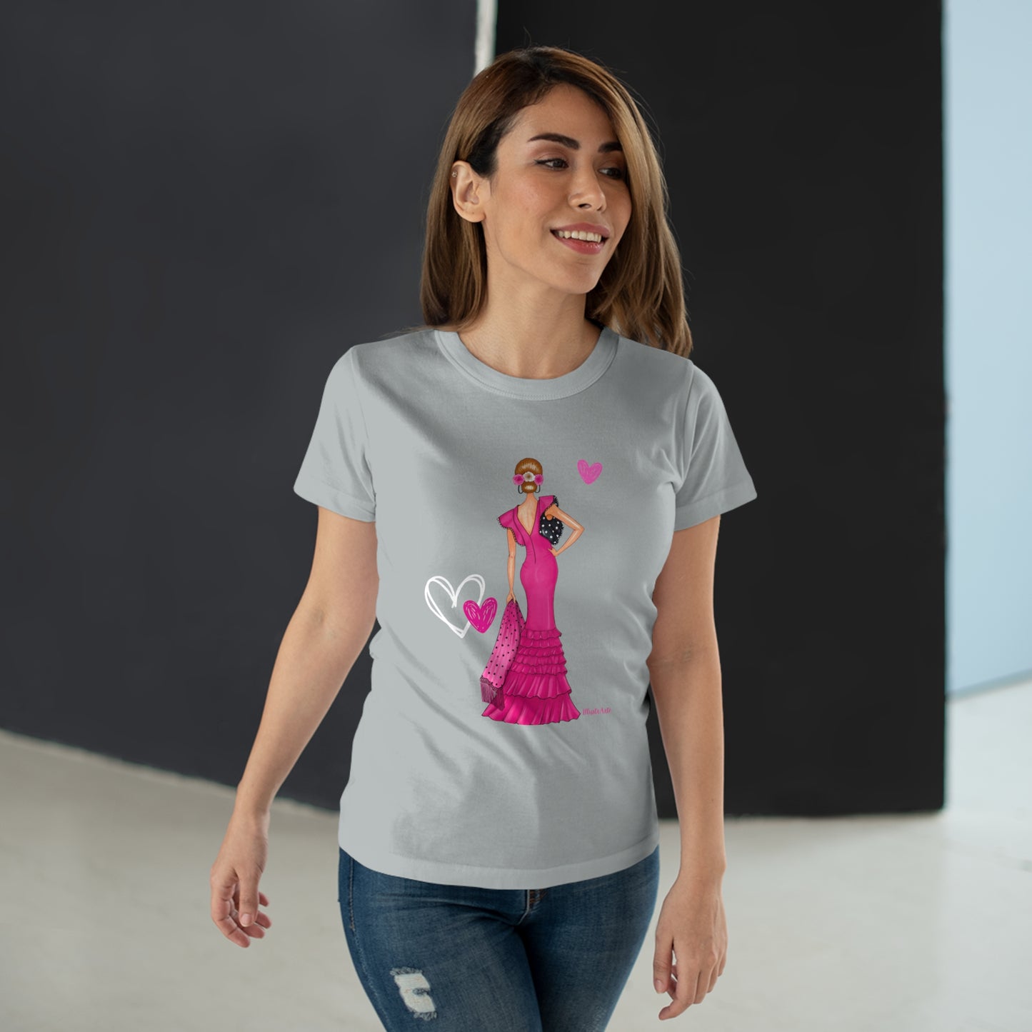 a woman wearing a t - shirt with a heart on it