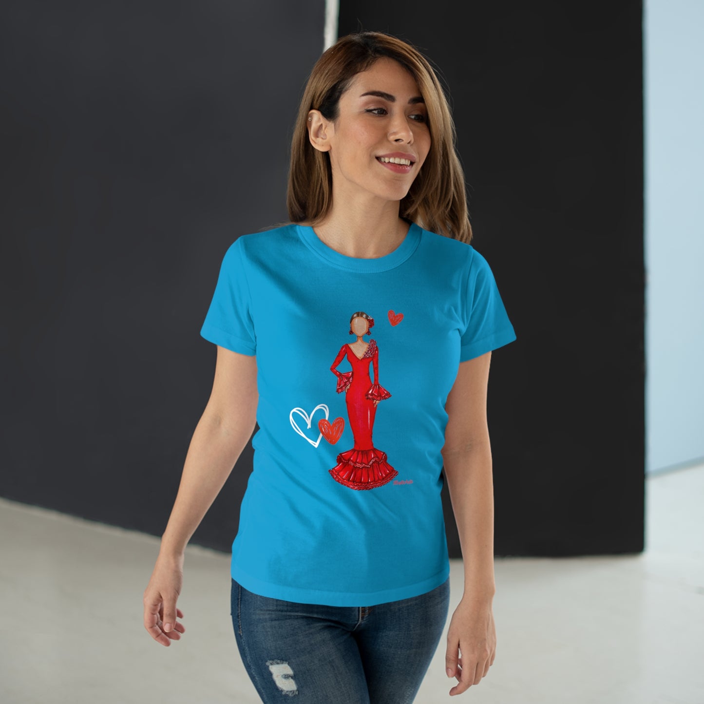 a woman wearing a blue t - shirt with a picture of a woman in a