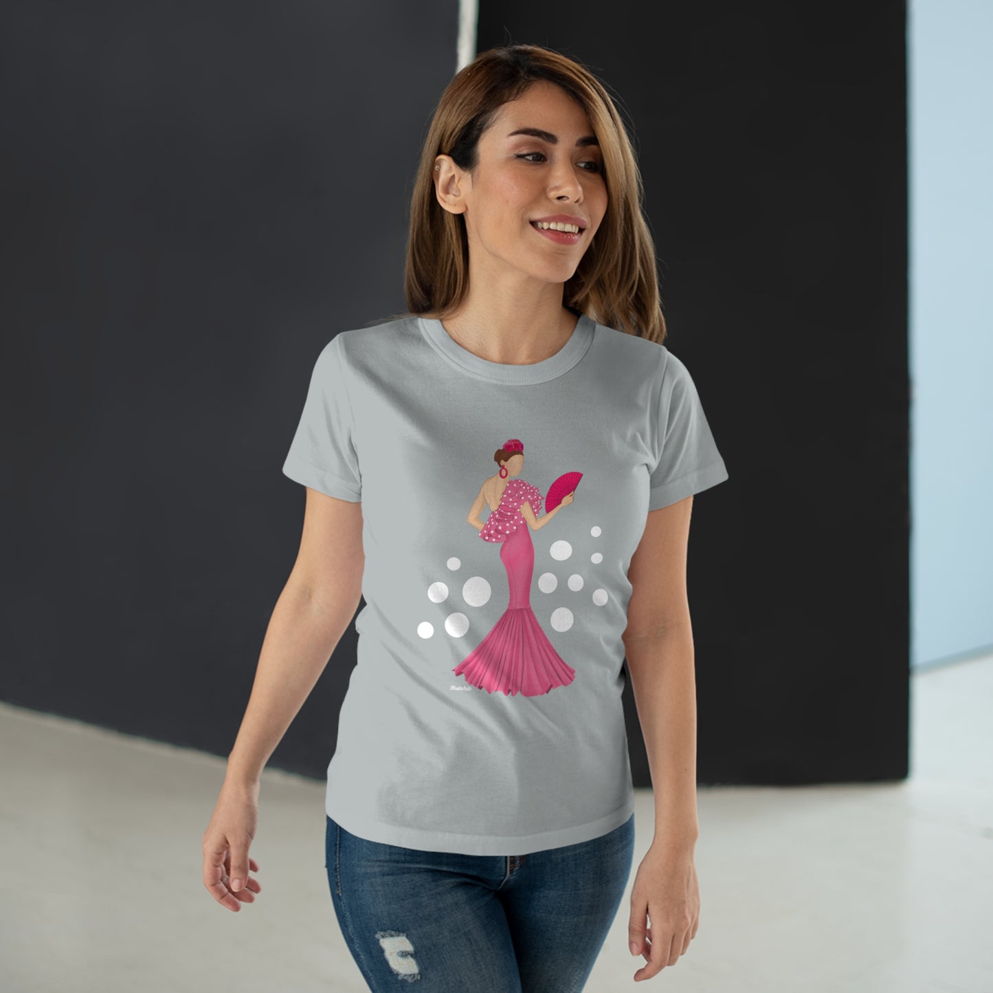 a woman wearing a t - shirt with an image of a woman in a pink