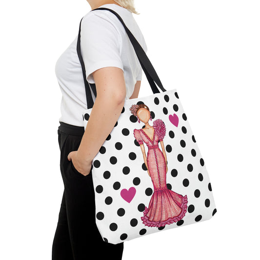 a woman is carrying a polka dot purse