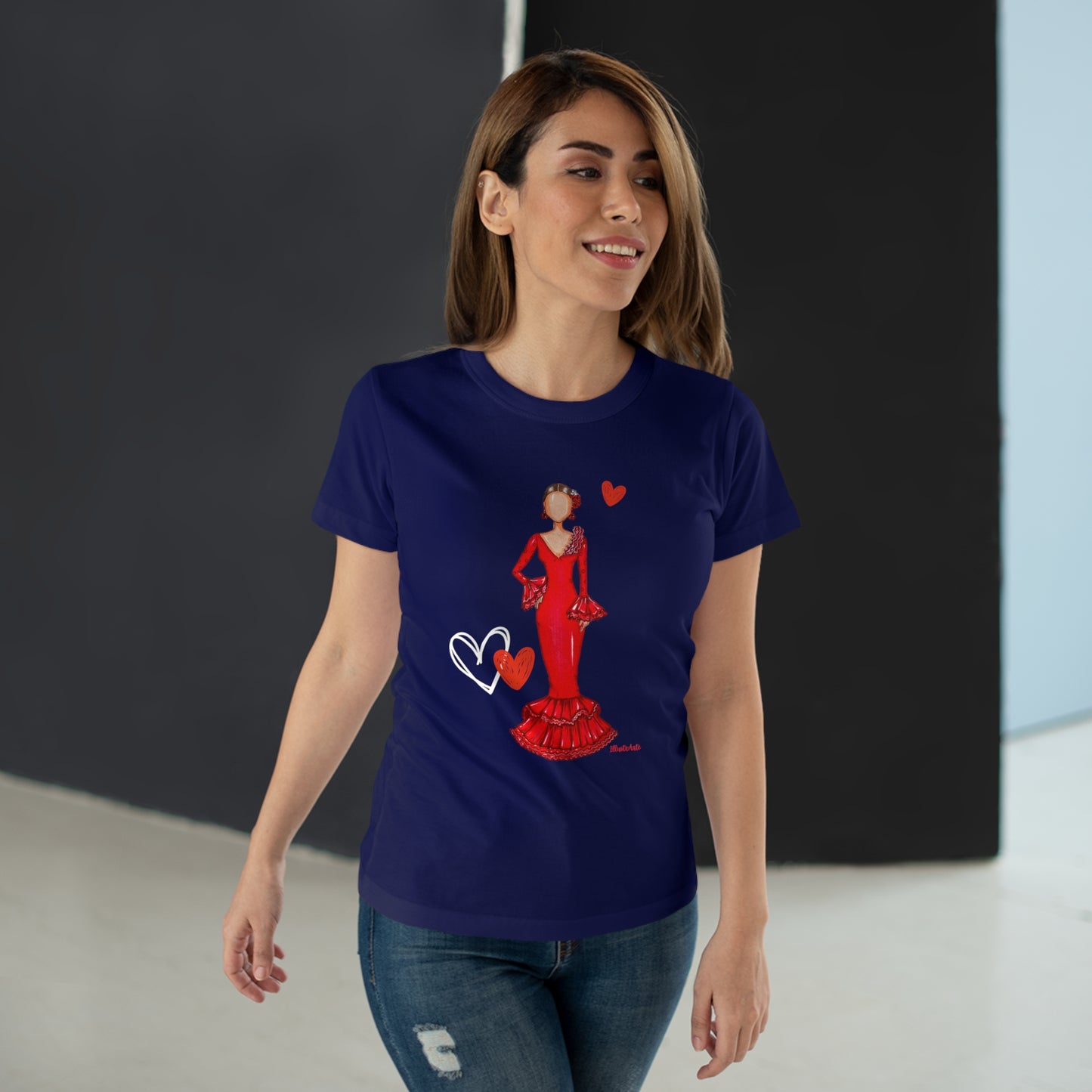 a woman wearing a blue t - shirt with a picture of a woman in a