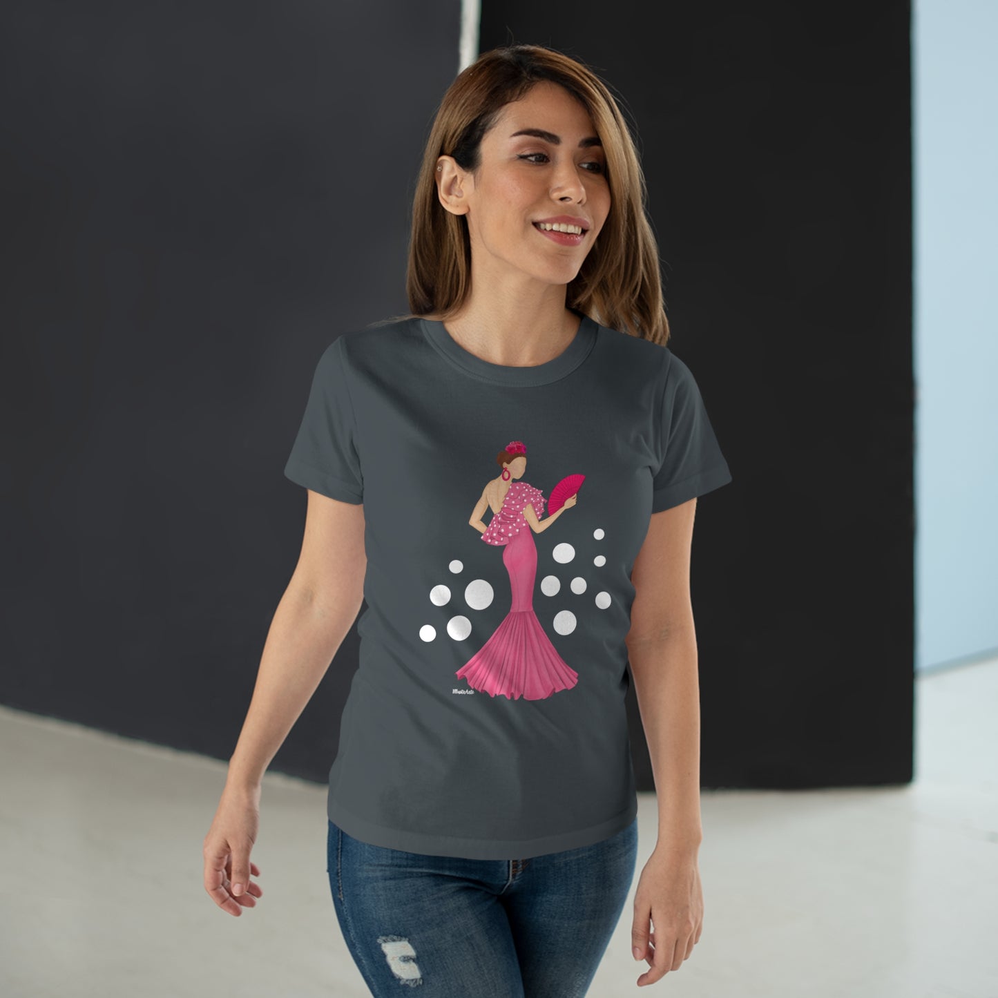 a woman wearing a t - shirt with a graphic of a woman in a pink