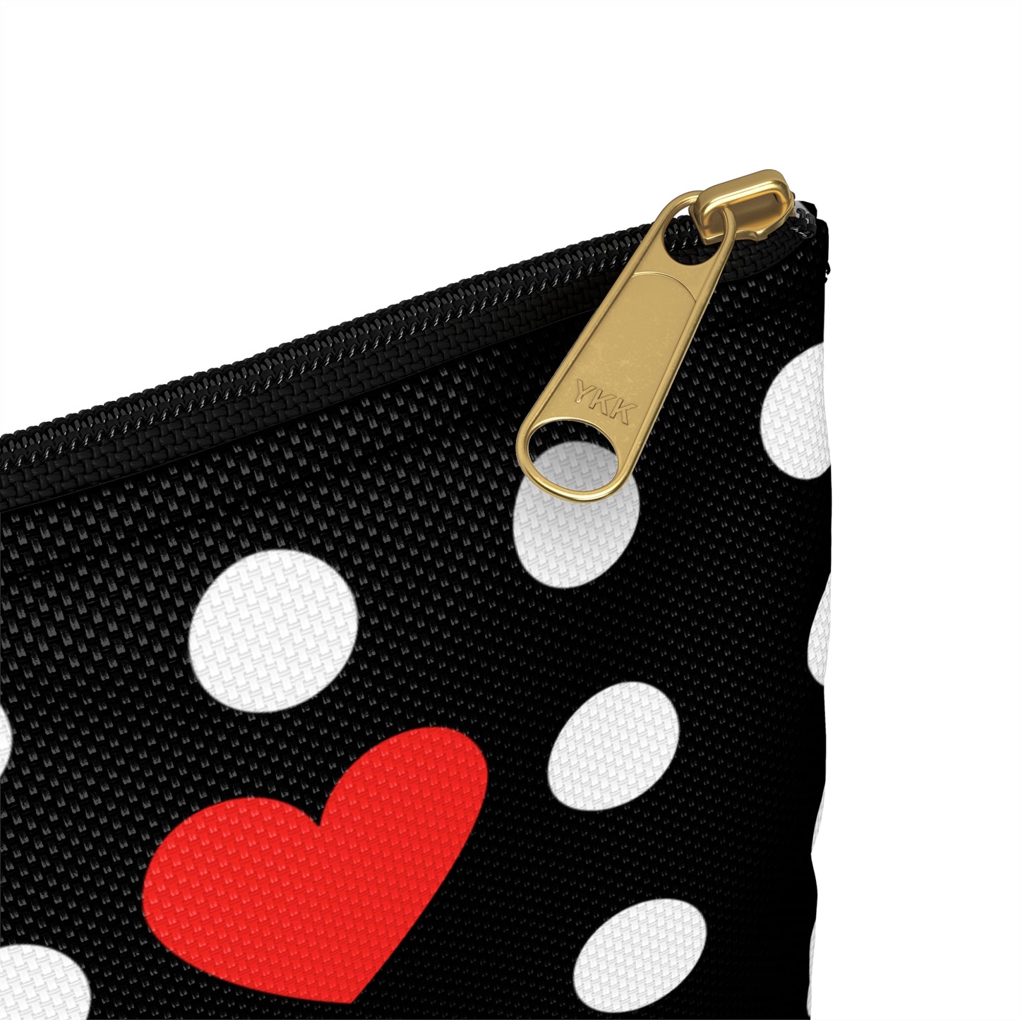 a polka dot purse with a red heart on it