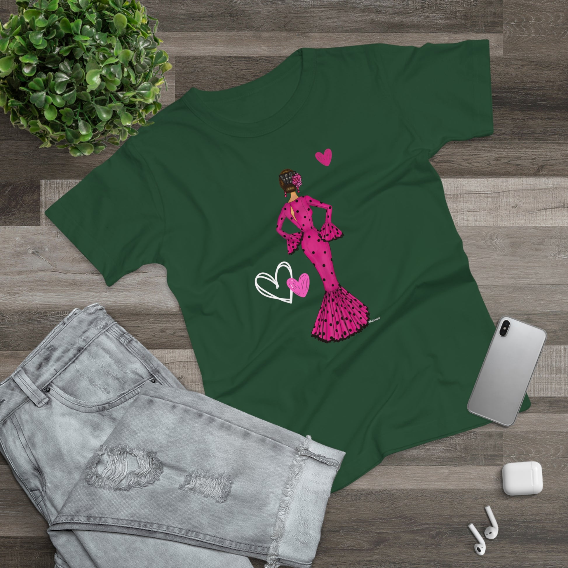 a green t - shirt with a picture of a woman in a pink dress