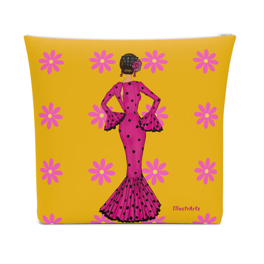 a yellow and pink pillow with a picture of a woman in a pink dress