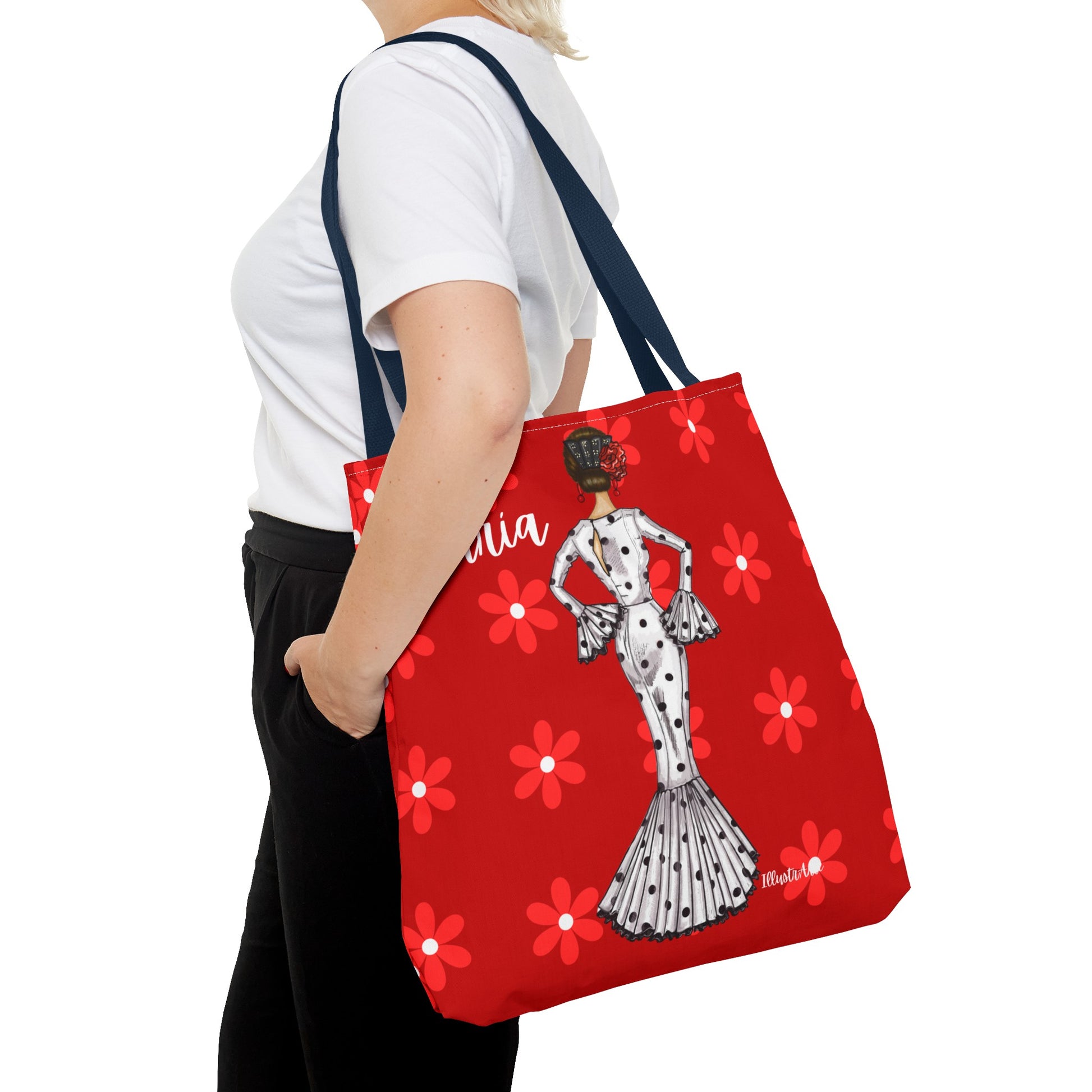 a woman carrying a red bag with a picture of a woman on it