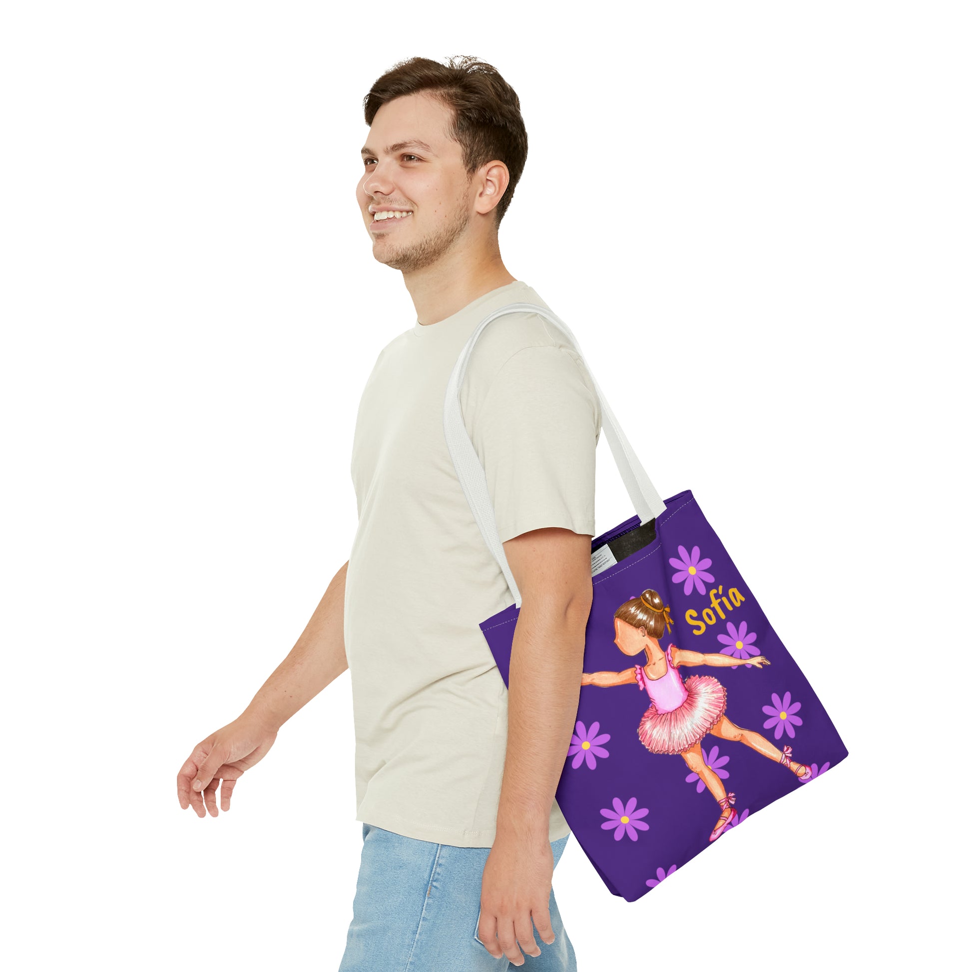 a man carrying a purple bag with a picture of a ballerina on it