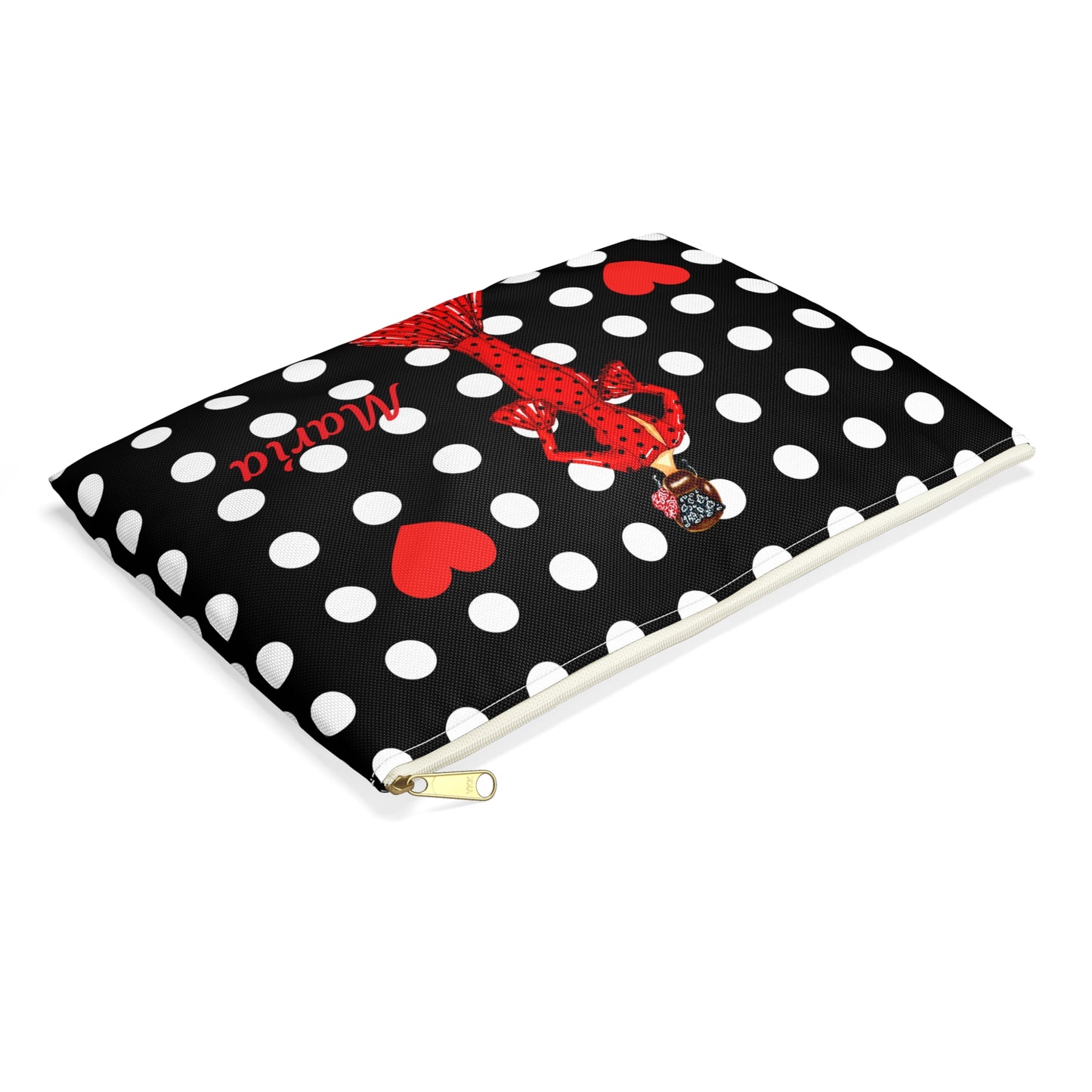 a black and white polka dot notebook with a red bow