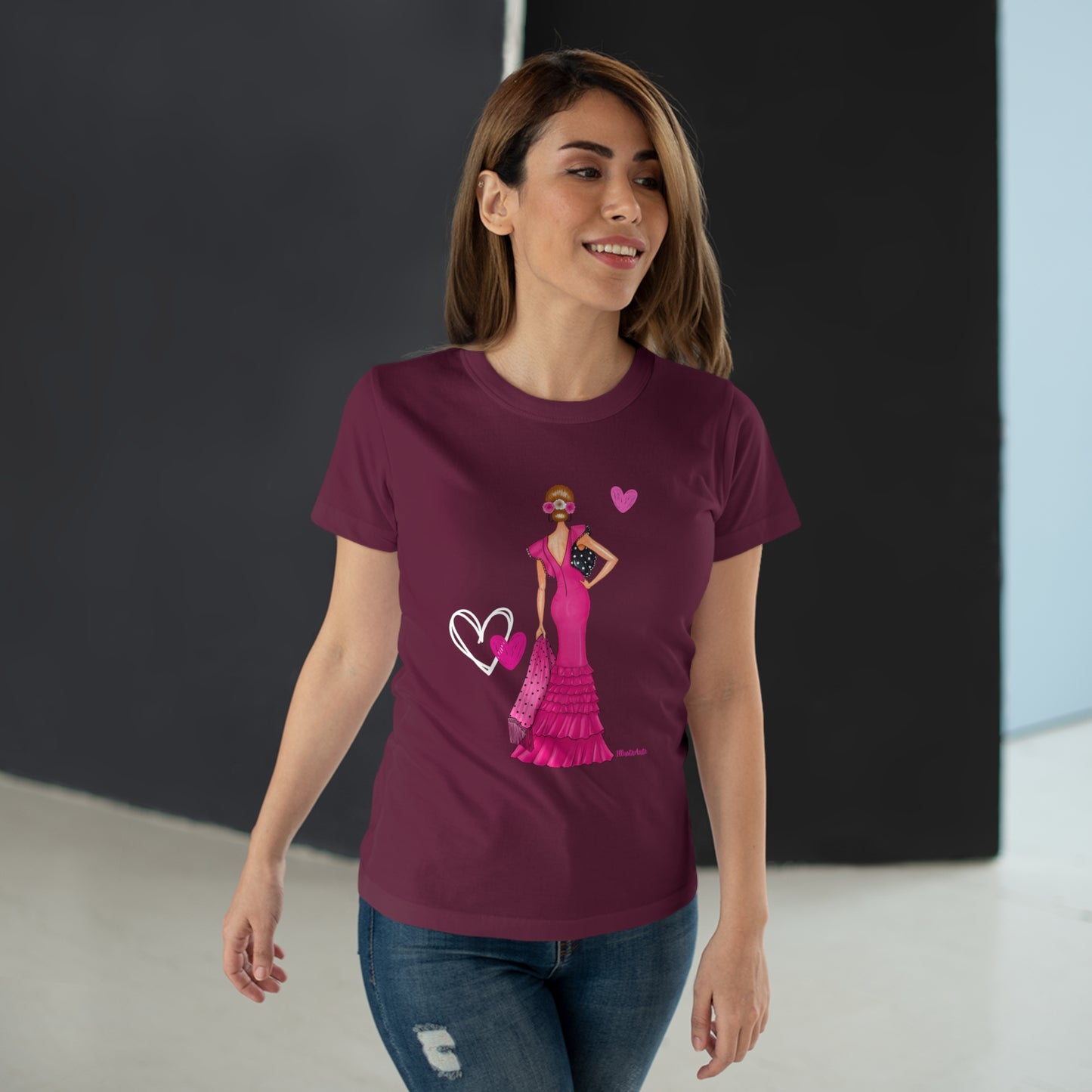 a woman wearing a t - shirt with a picture of a woman in a pink