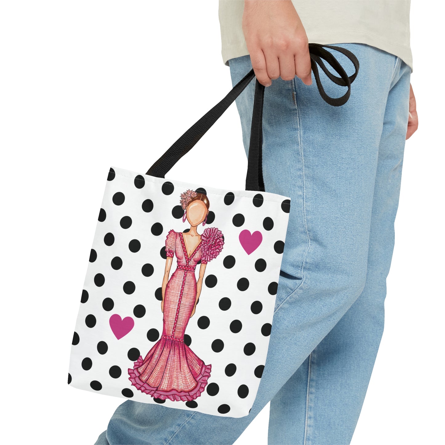 a woman carrying a shopping bag with a picture of a woman on it