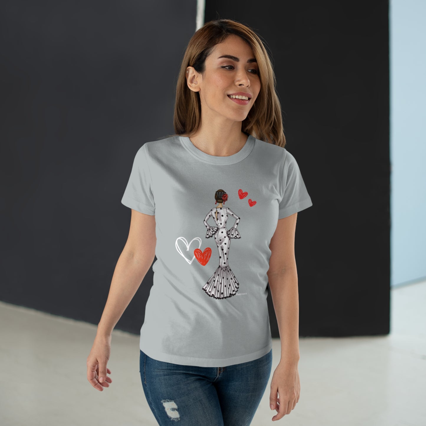 a woman wearing a t - shirt with a heart on it