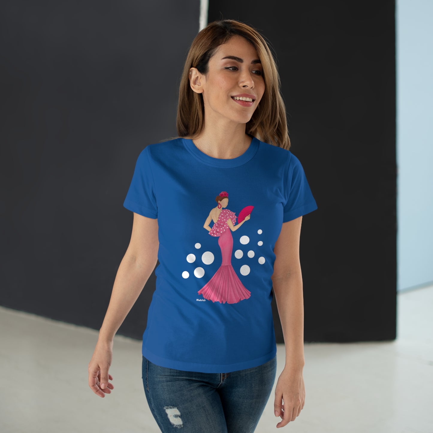 a woman in a blue t - shirt is walking