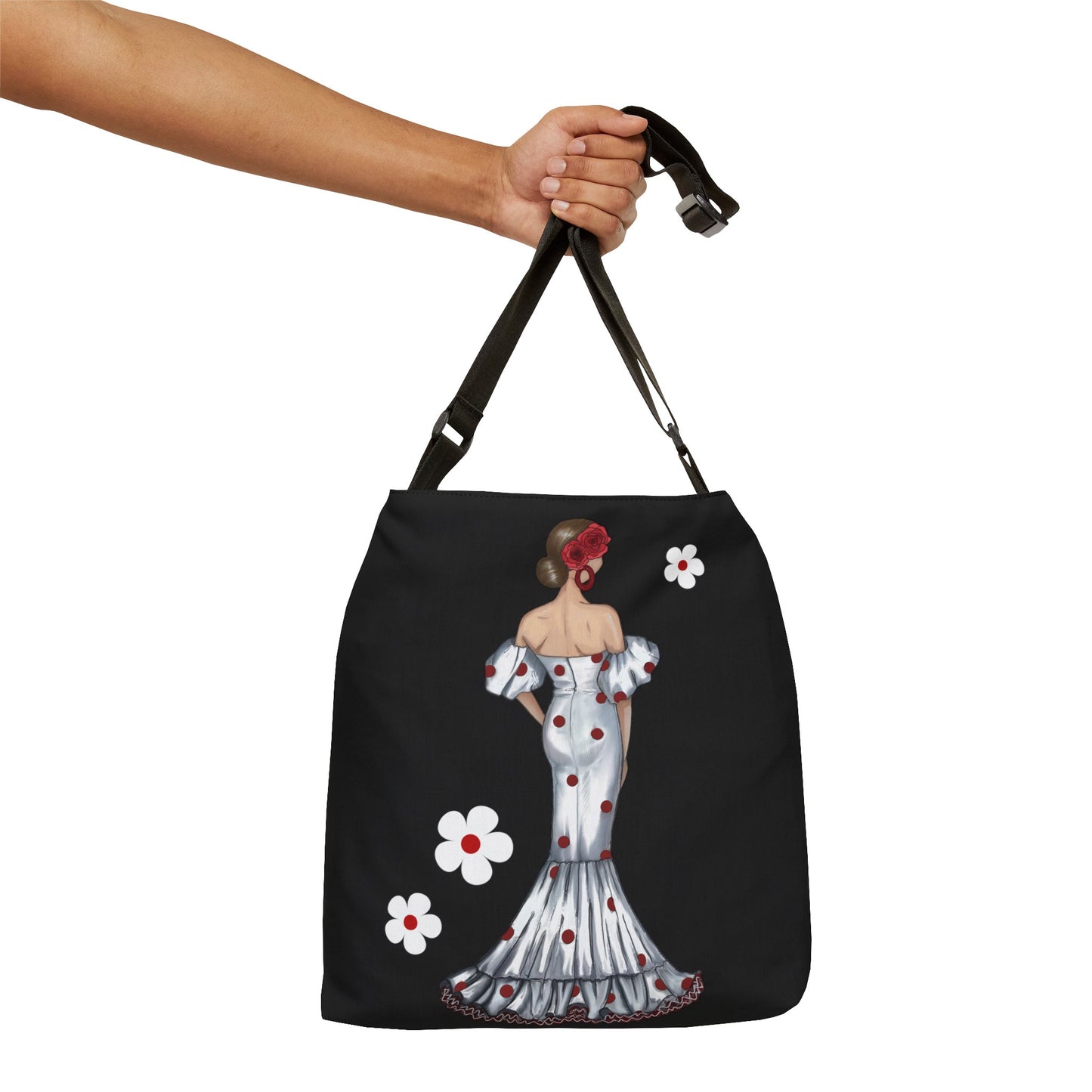 a woman's hand holding a tote bag with a picture of a woman