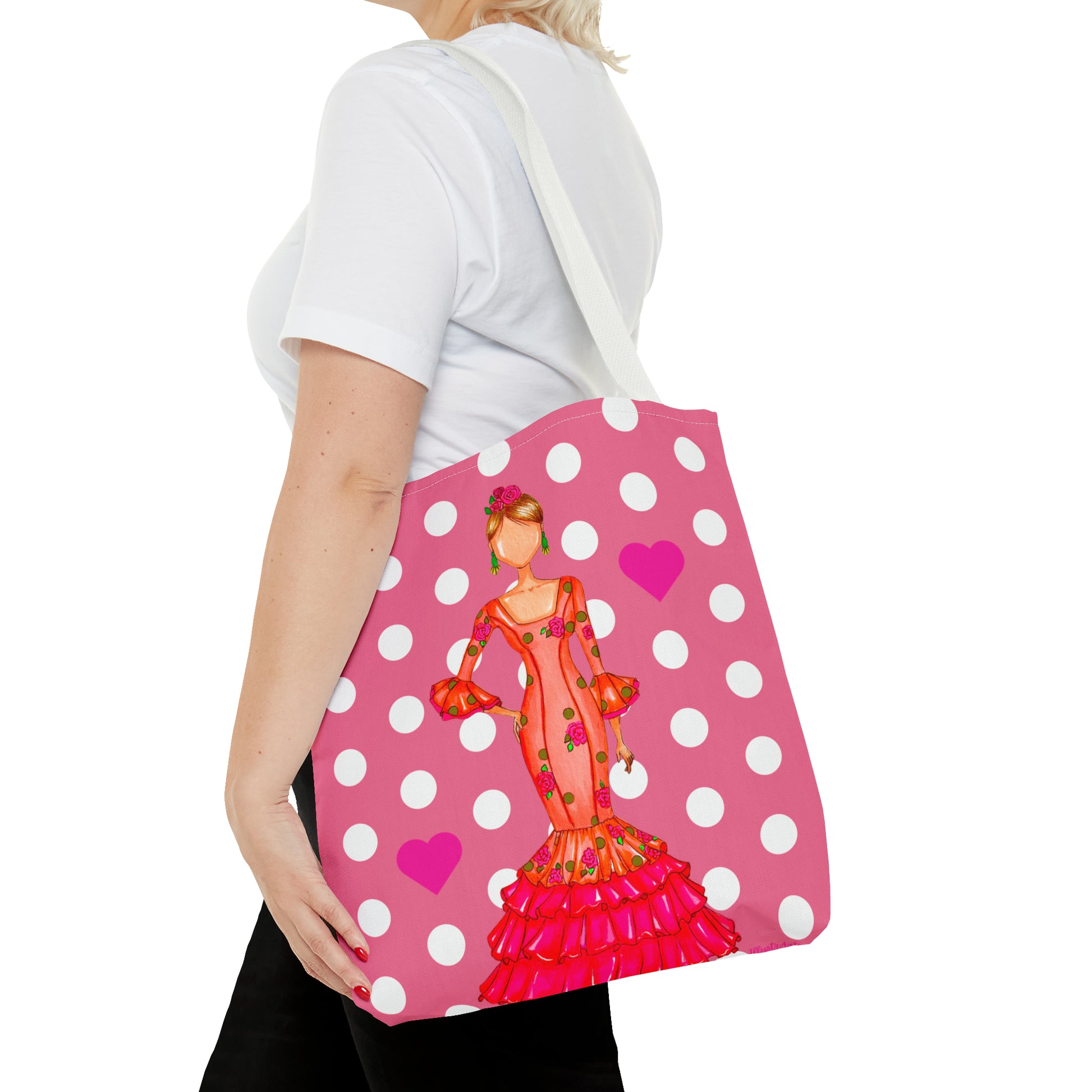 a woman carrying a pink polka dot purse