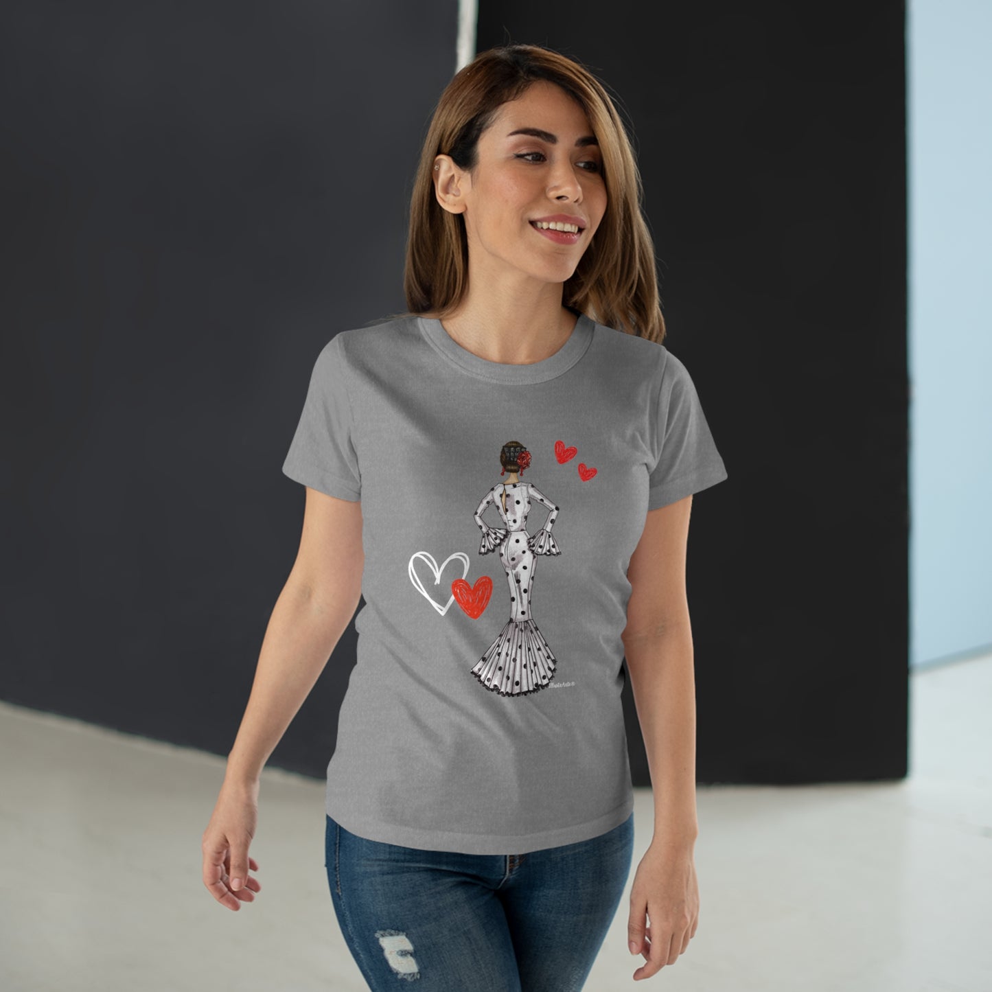 a woman wearing a t - shirt with a heart on it