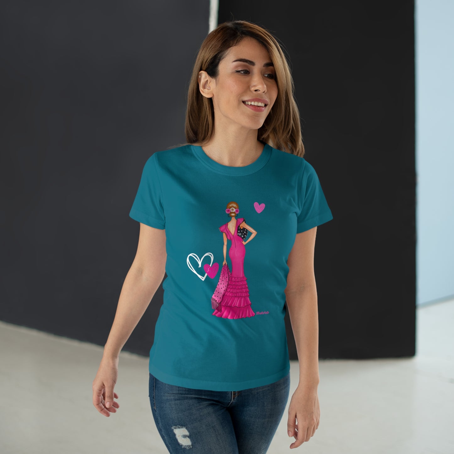 a woman wearing a t - shirt with a picture of a woman in a pink