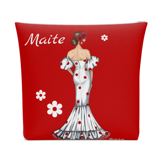 a red pillow with a picture of a woman in a dress