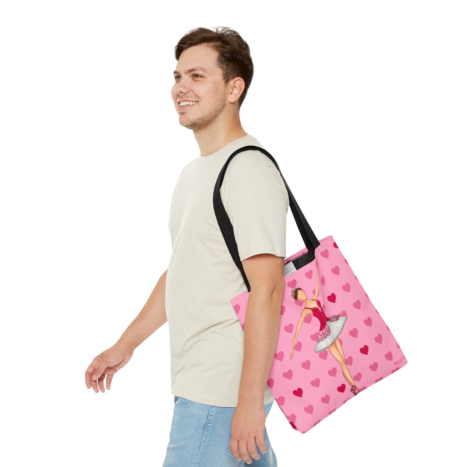 a man carrying a pink bag with hearts on it