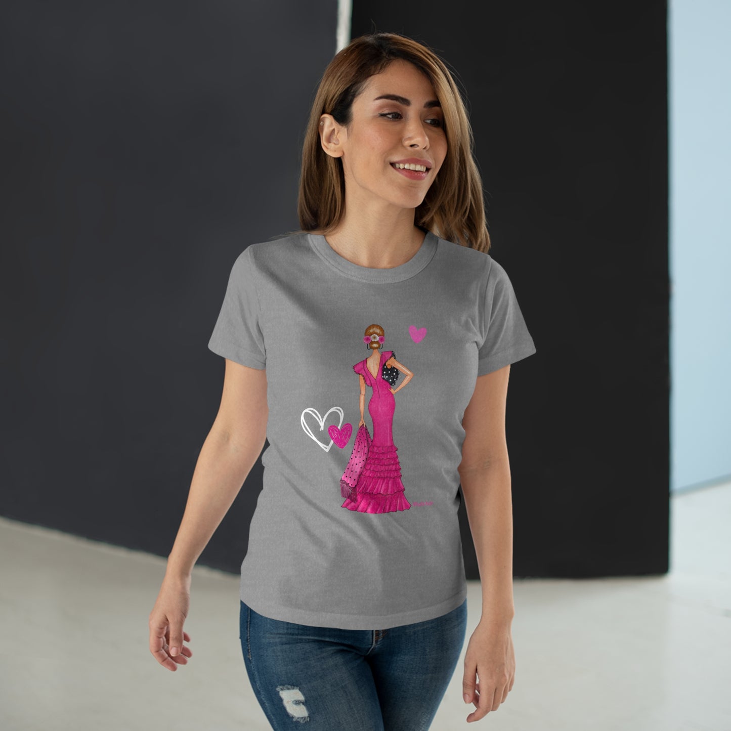 a woman wearing a t - shirt with a heart on it