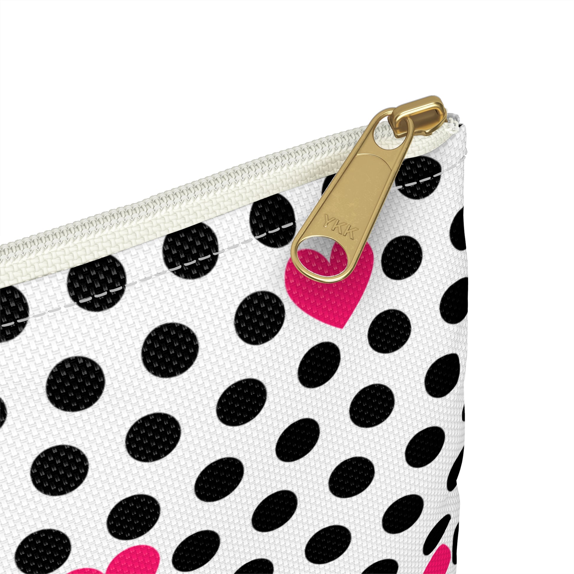 a black and white polka dot purse with a pink heart on it