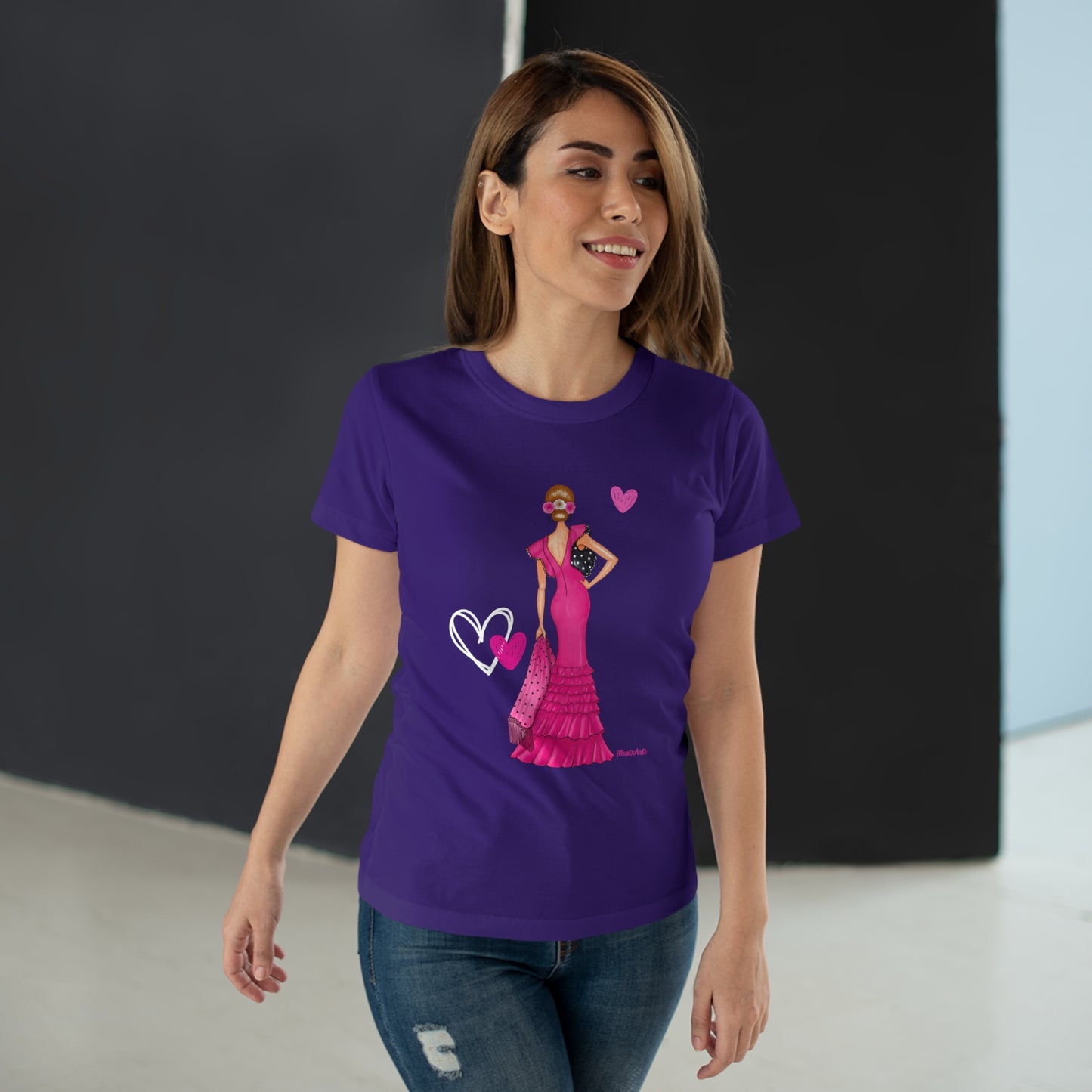 a woman wearing a purple t - shirt with a picture of a woman in a