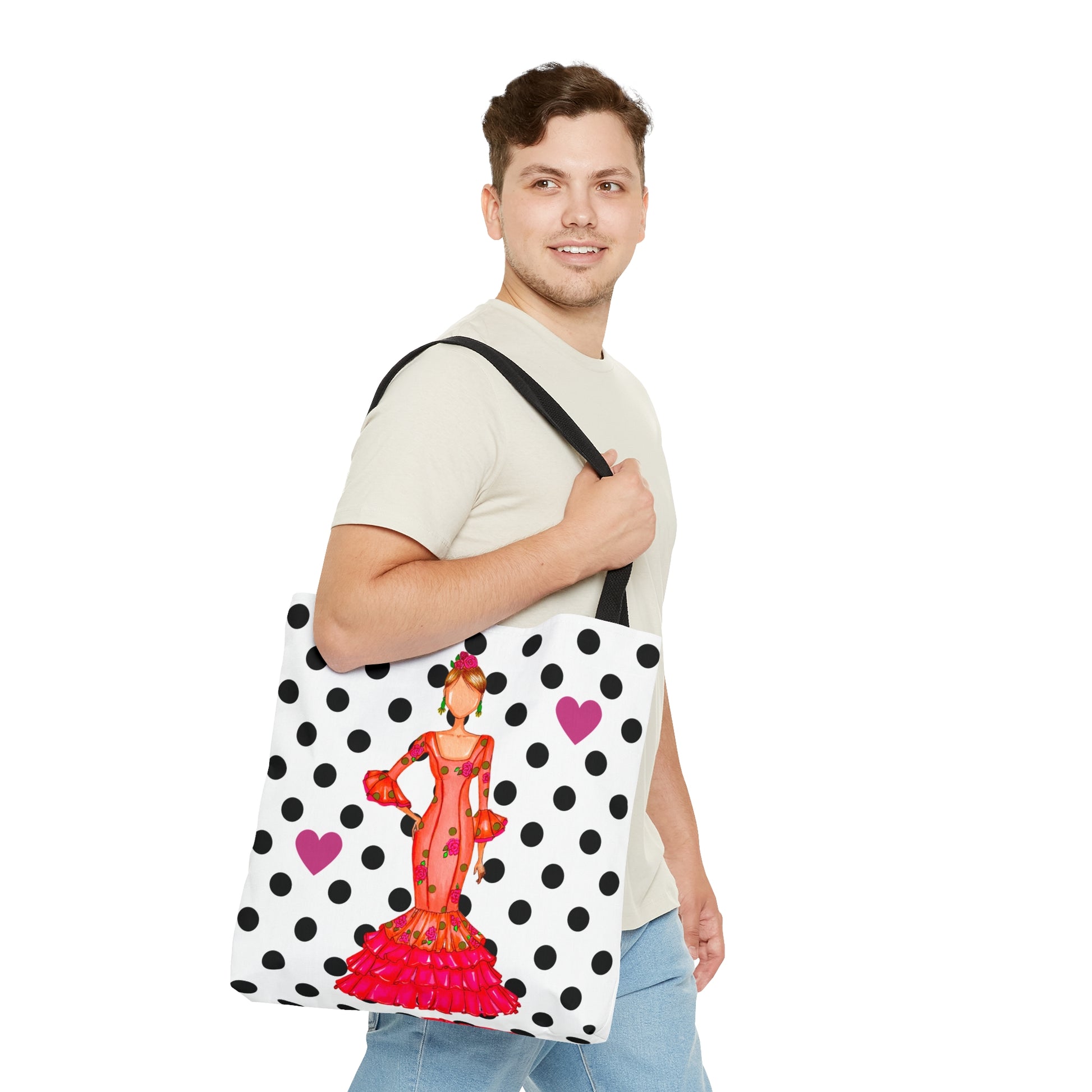 a man holding a polka dot bag with a woman on it