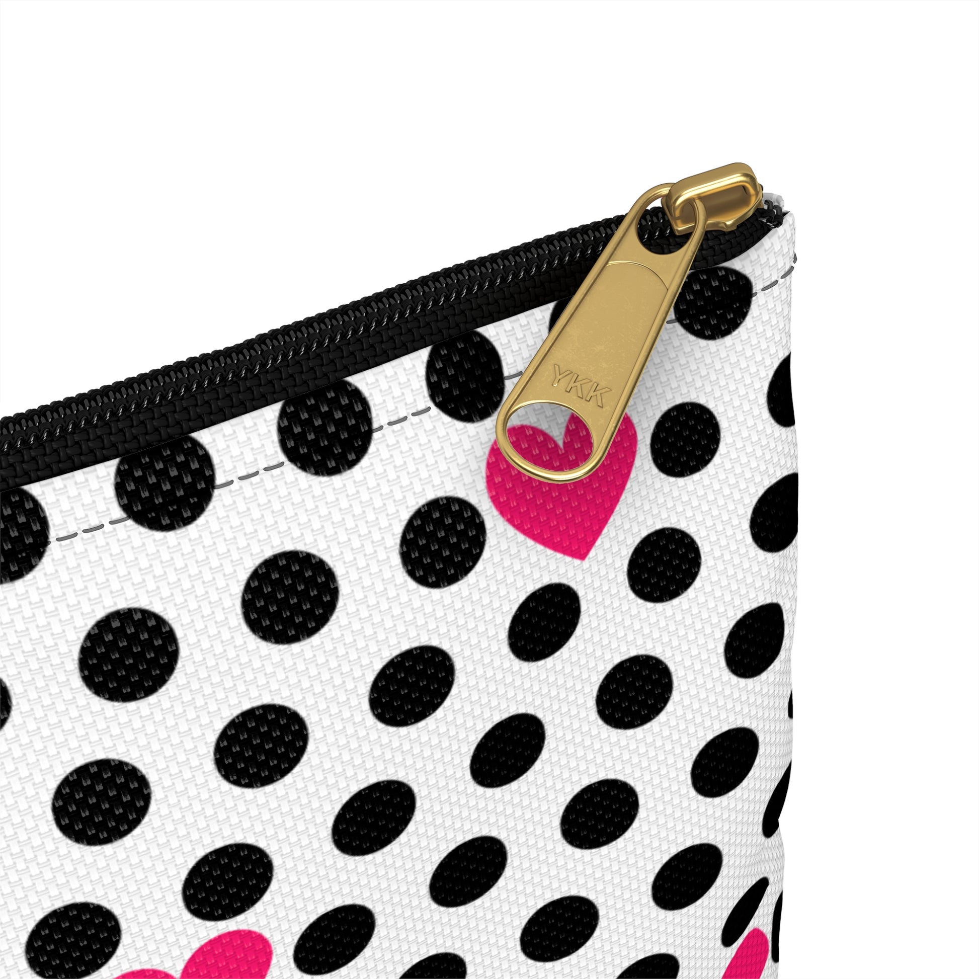 a black and white polka dot purse with a pink heart on it