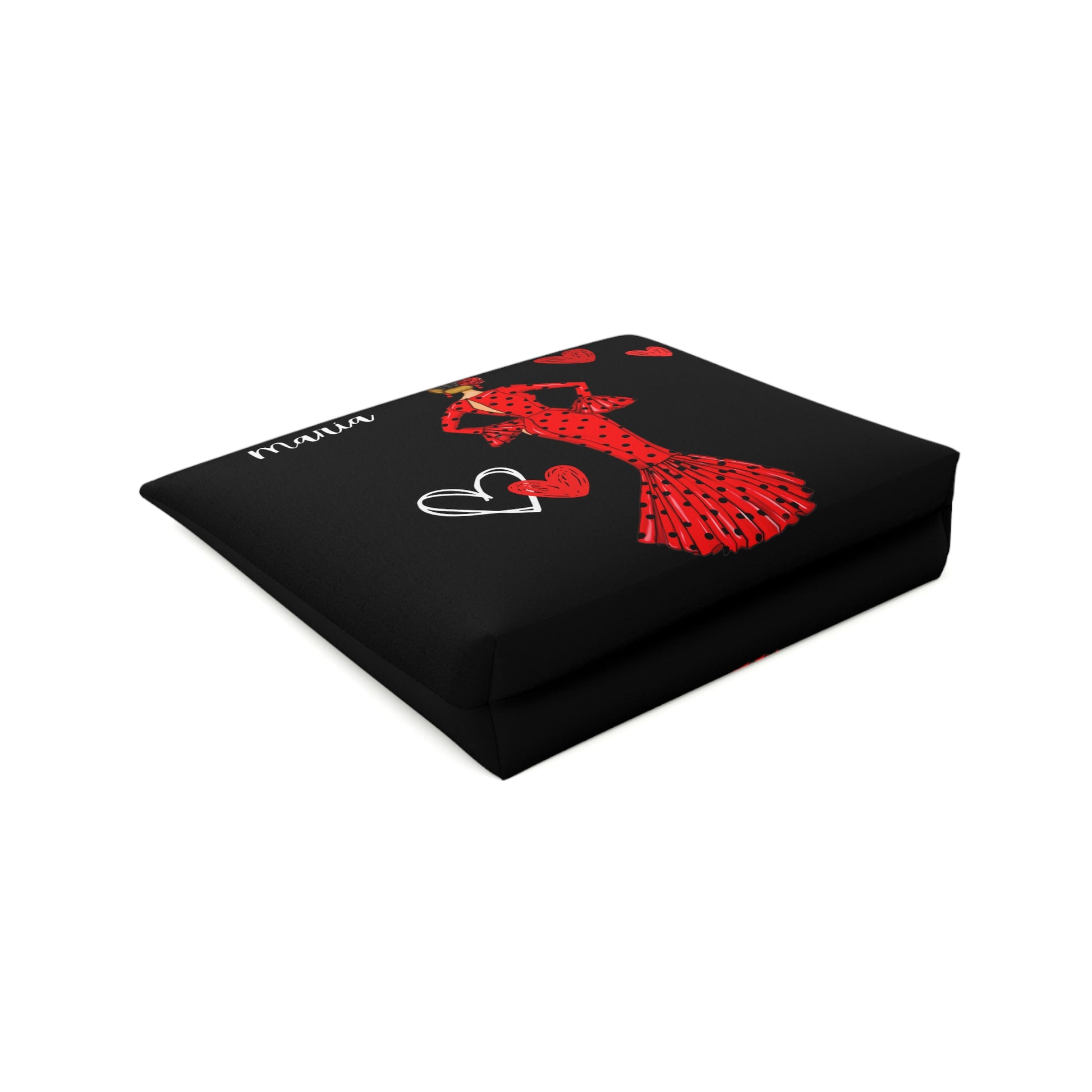 a black square pillow with a red design on it