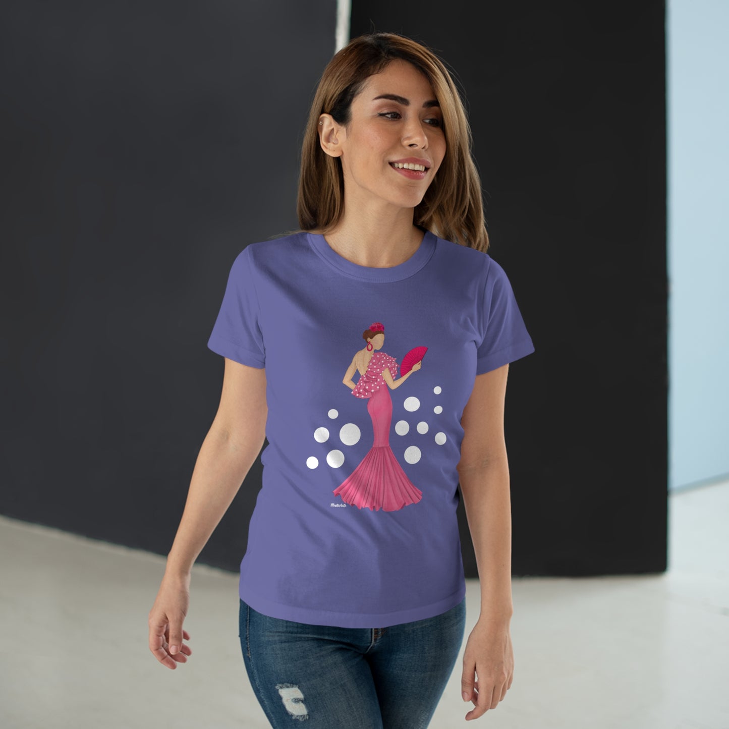 a woman wearing a purple t - shirt with a picture of a woman in a