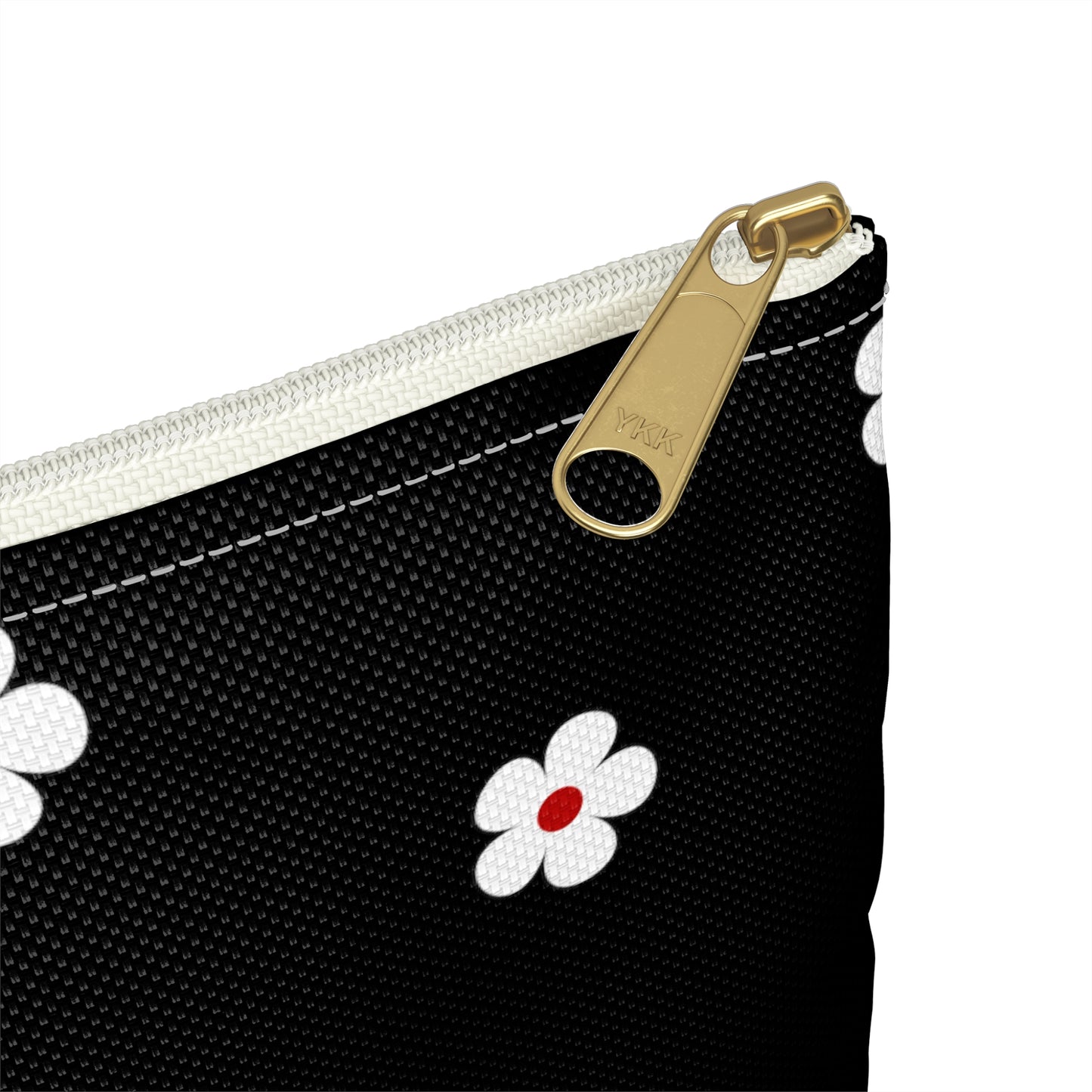 a black and white purse with a flower on it