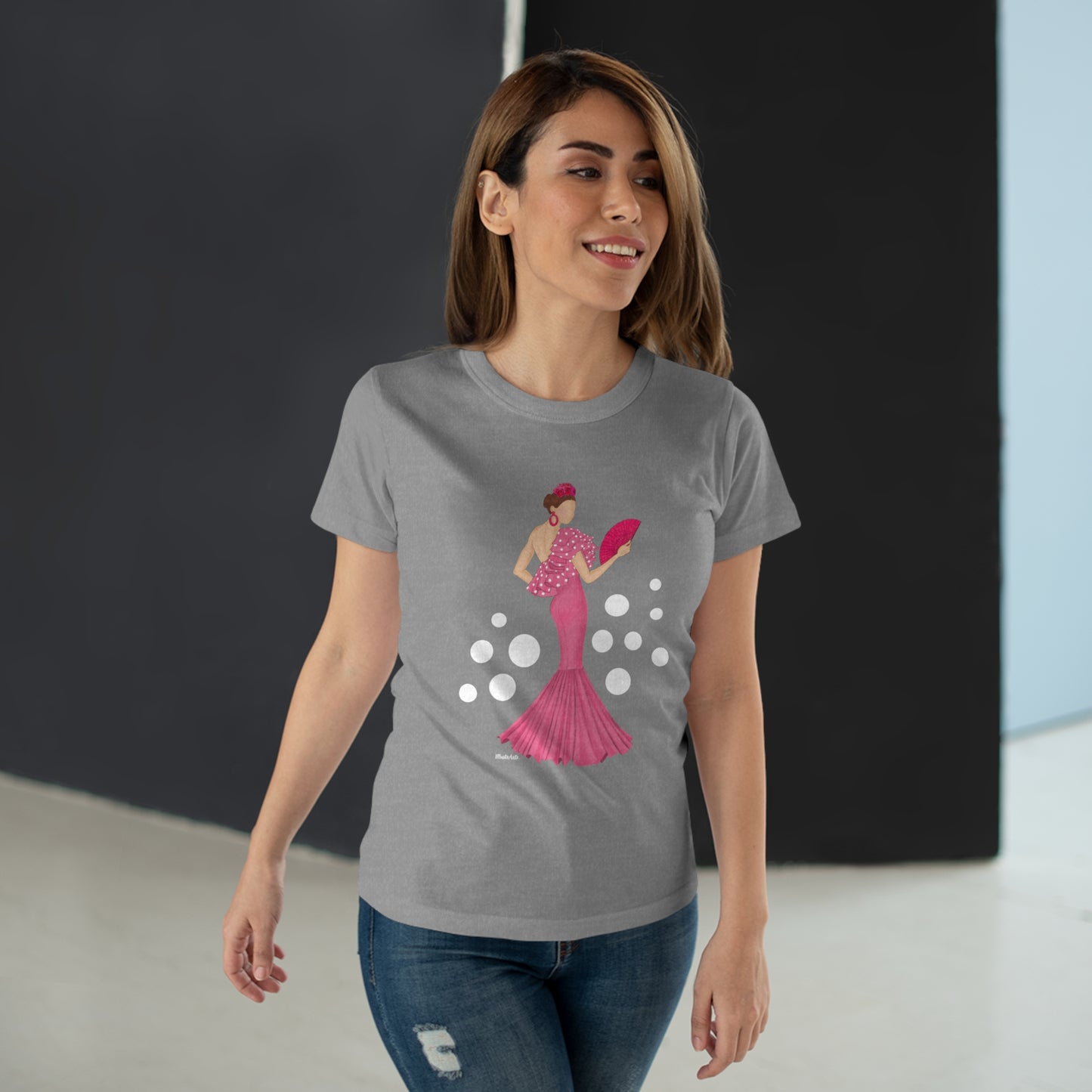 a woman wearing a t - shirt with a graphic of a woman in a pink