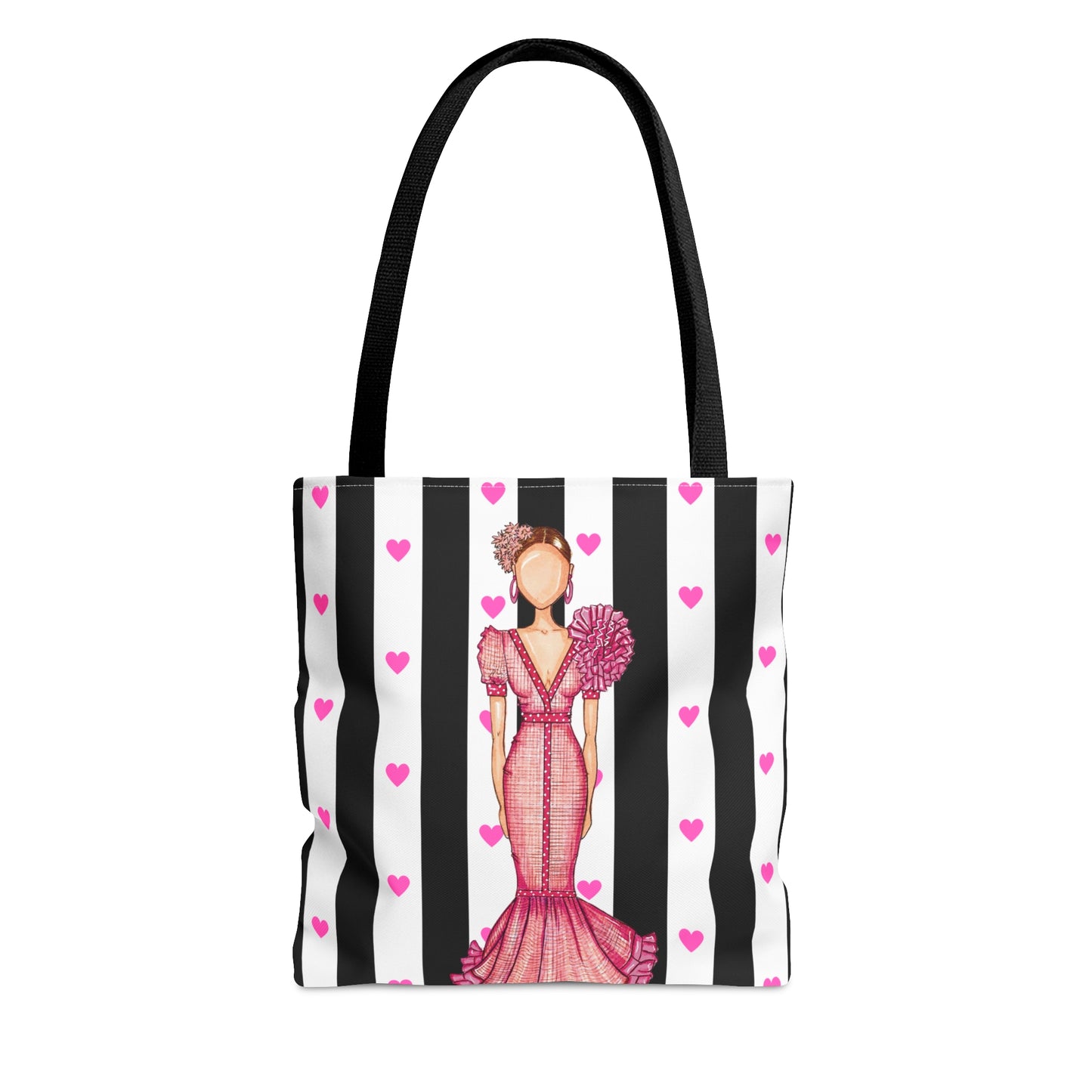 a black and white striped bag with a woman in a pink dress