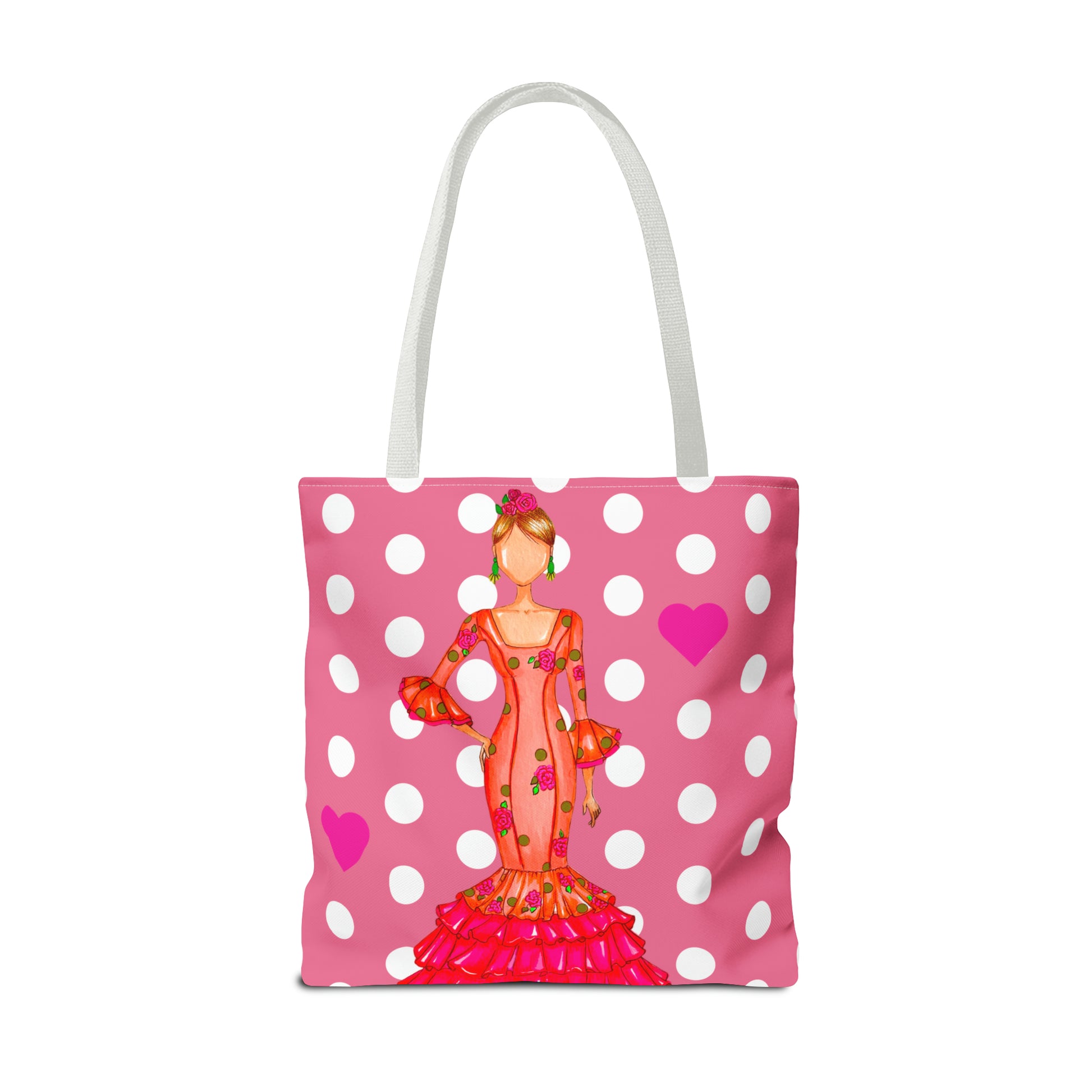 a pink polka dot bag with a picture of a woman on it