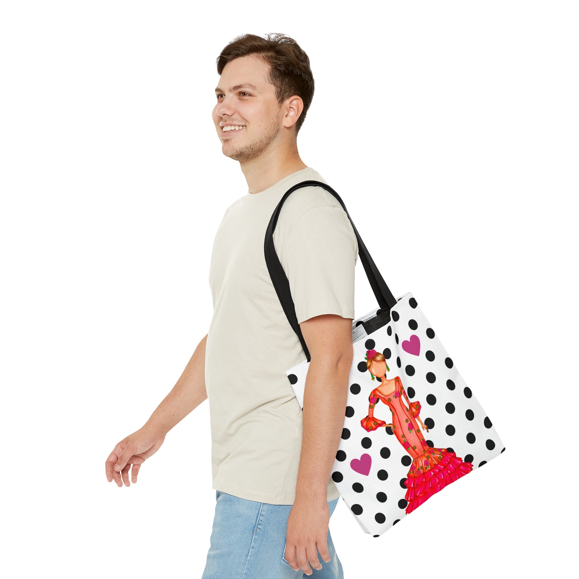 a man walking with a polka dot bag on his shoulder