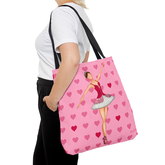 a woman carrying a pink bag with a ballerina on it