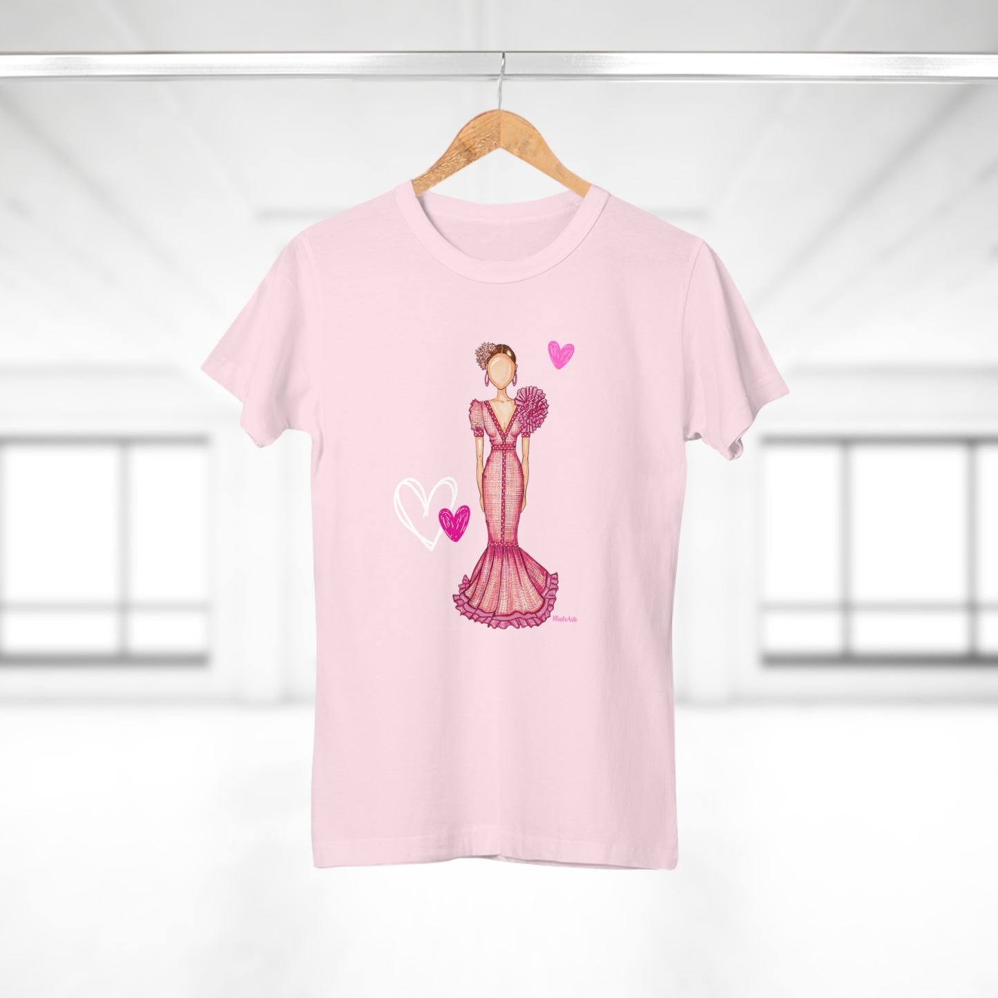 a pink t - shirt with an image of a woman in a dress