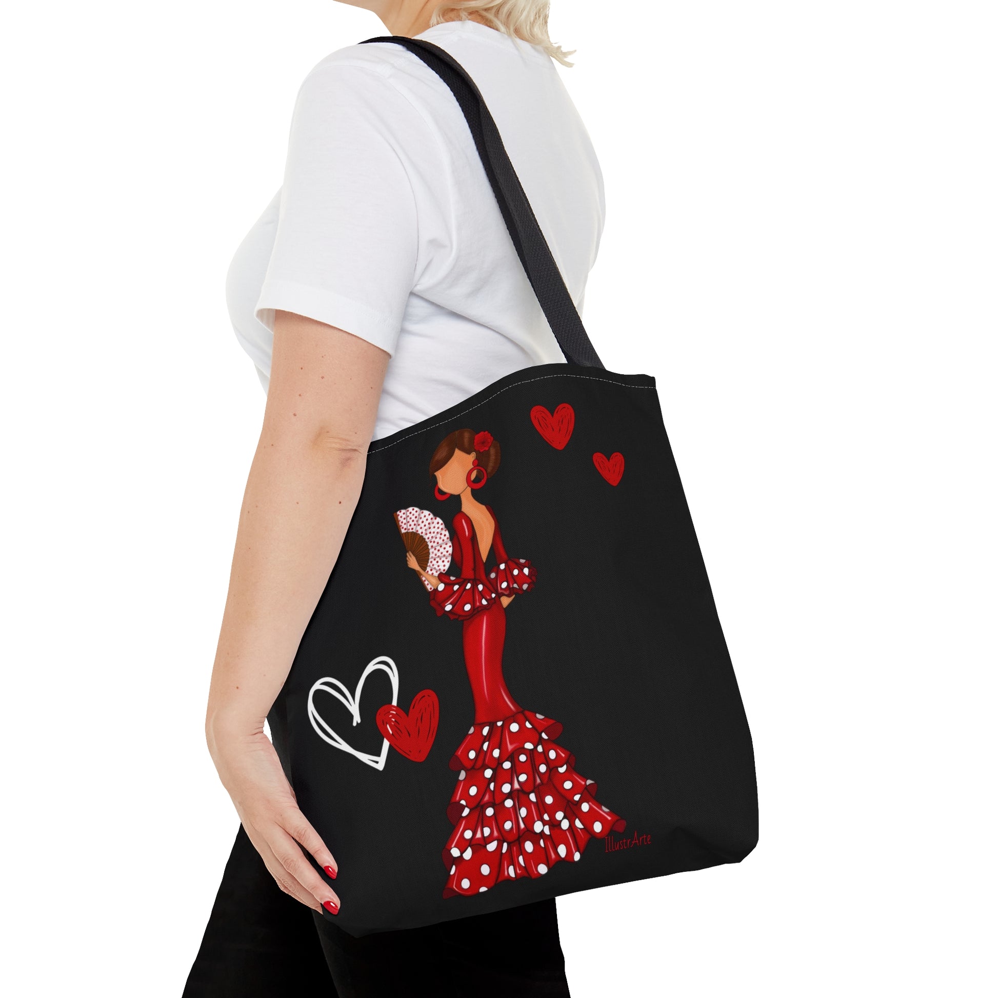 a woman carrying a tote bag with a picture of a woman in a dress