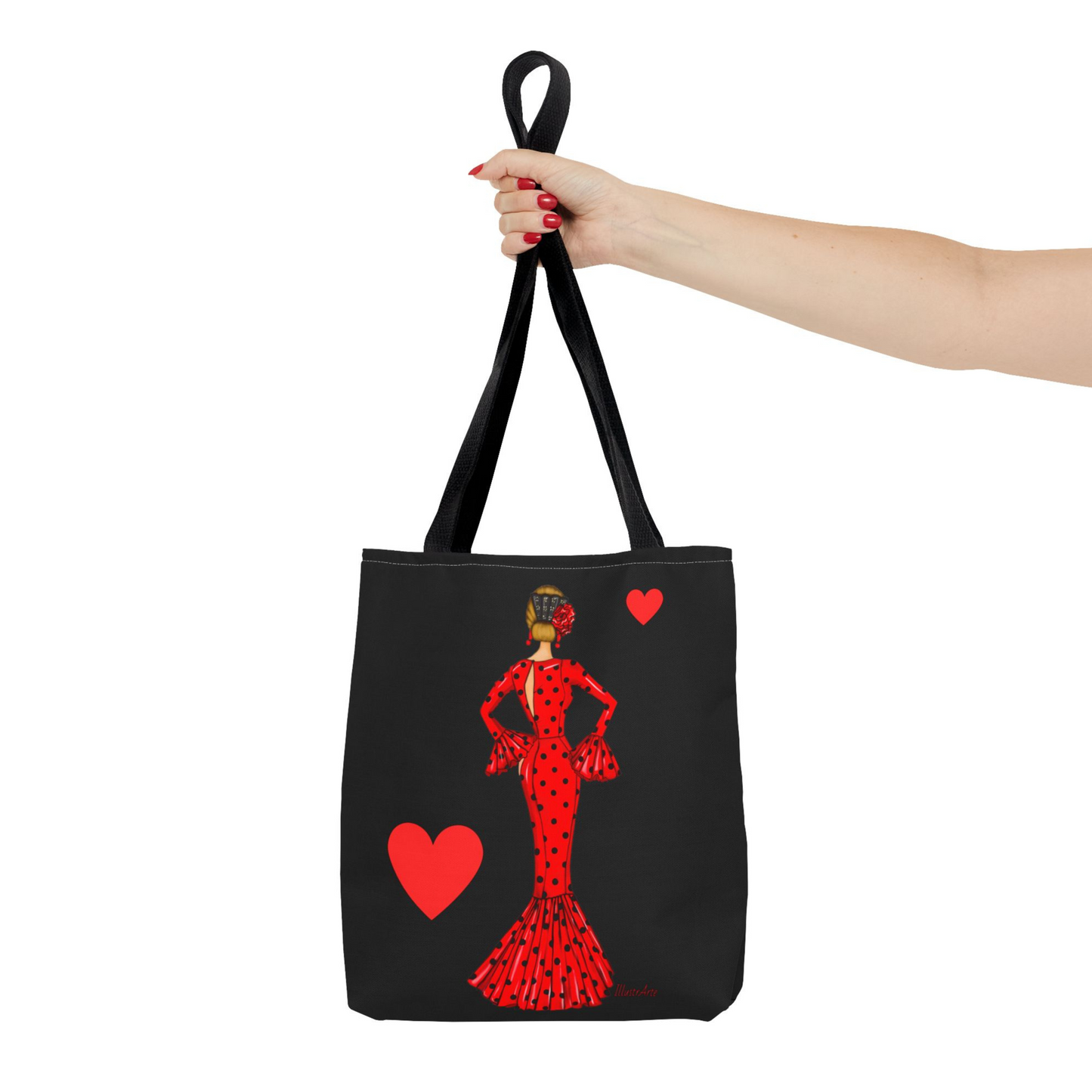 a woman's hand holding a tote bag with a picture of a woman