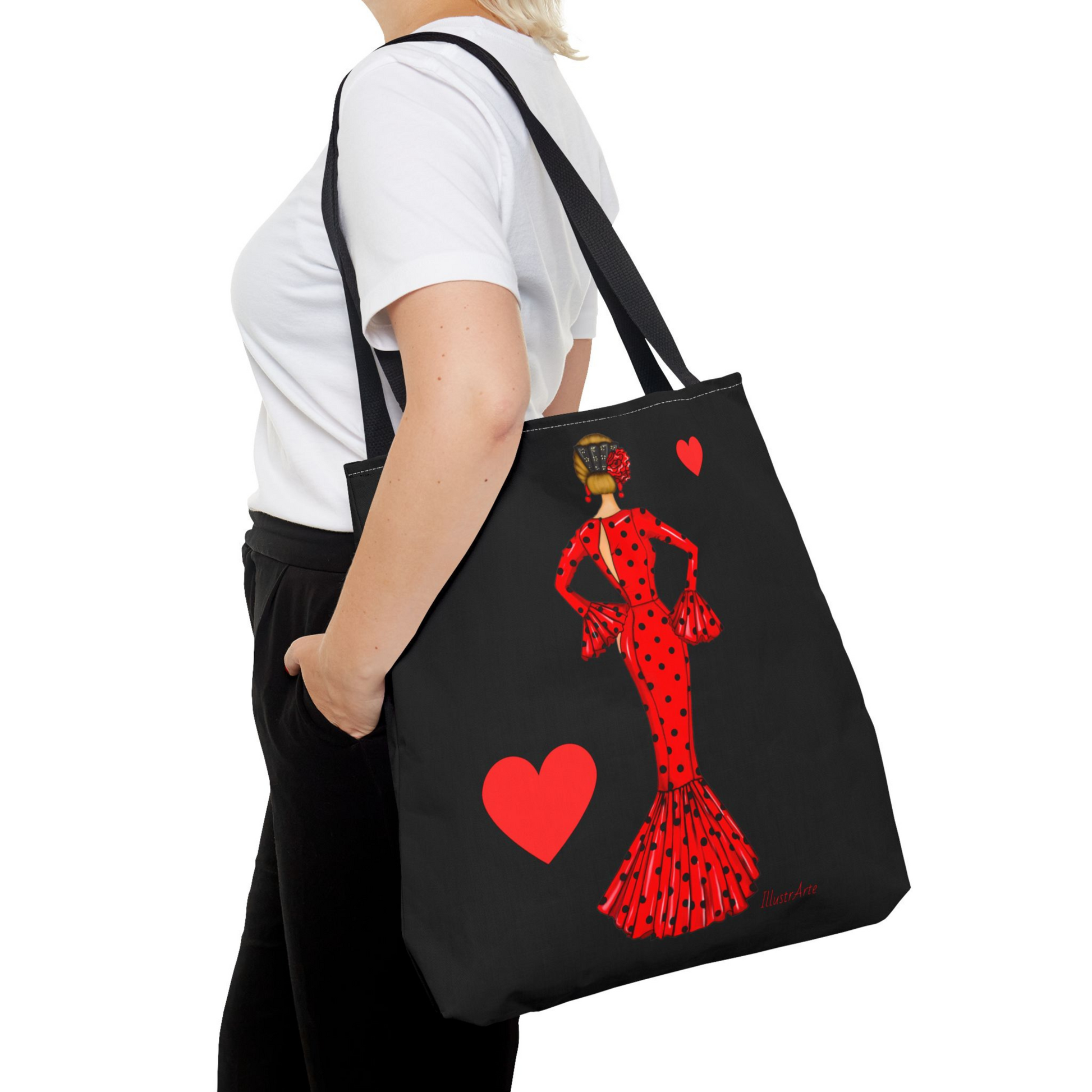 a woman carrying a tote bag with a picture of a woman in a red