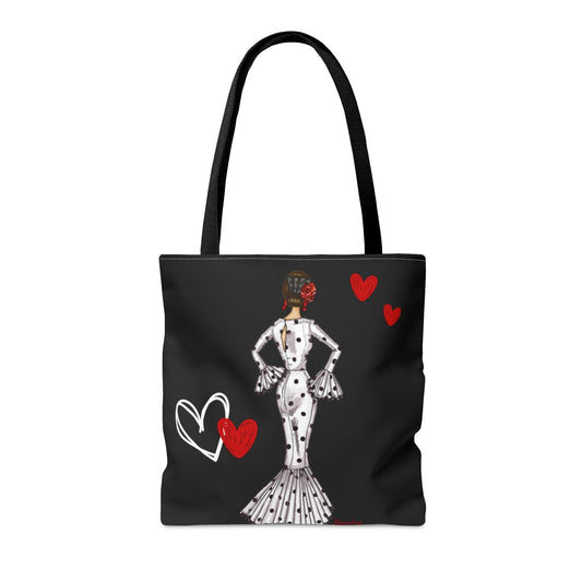 a black and white tote bag with a woman in a polka dot dress and