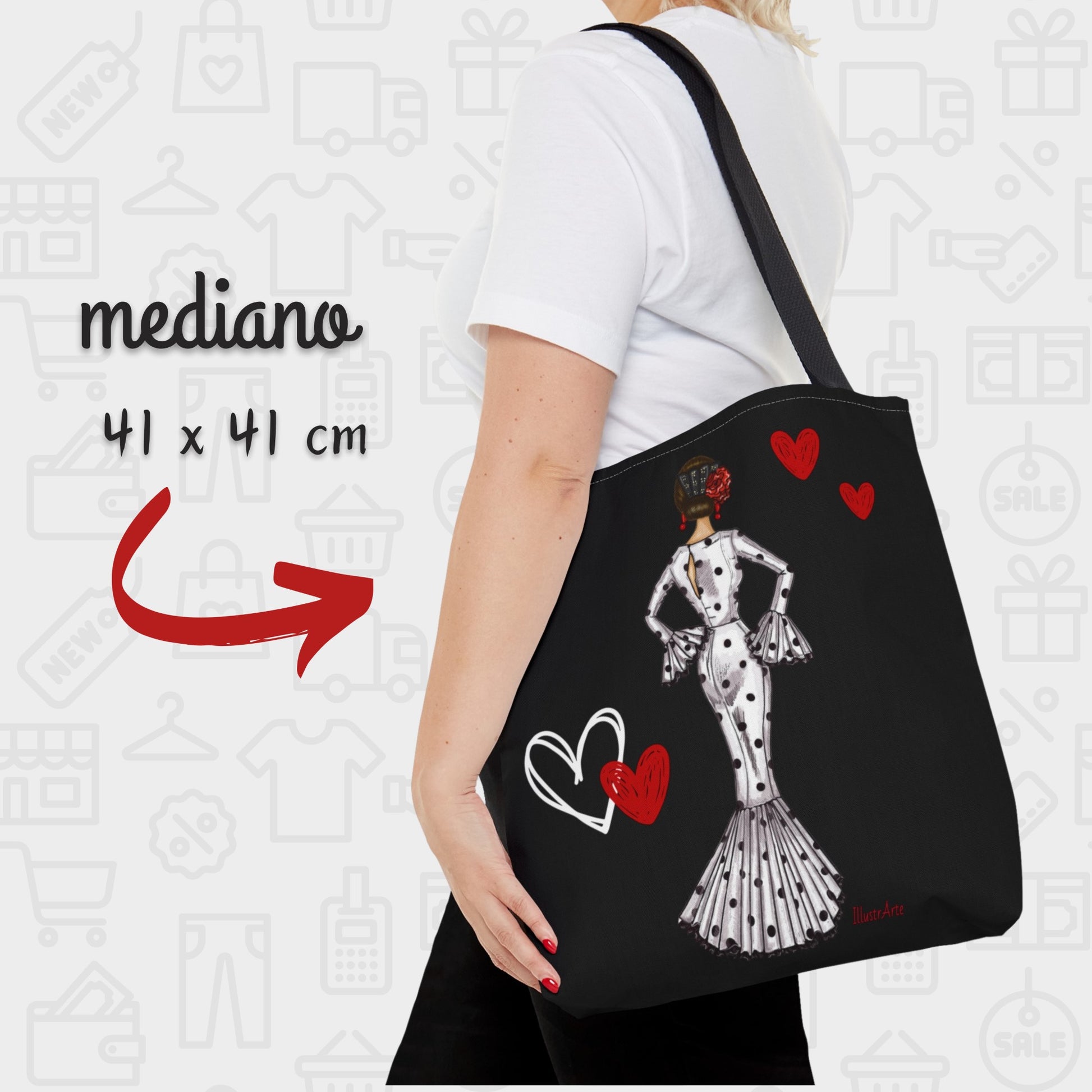 a woman carrying a black bag with a picture of a woman in a dress