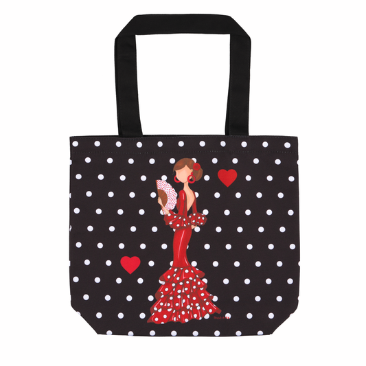 a black and white polka dot bag with a woman in a red dress