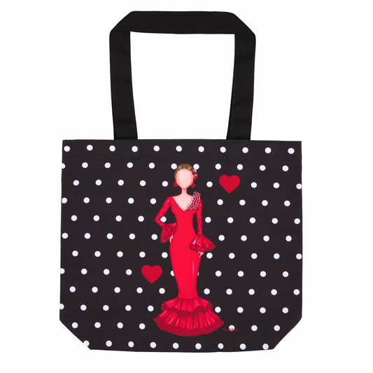 a black and white polka dot bag with a woman in a red dress