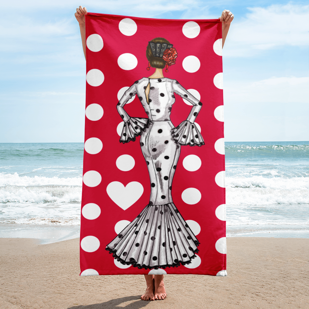 Toalla Flamenca de Microfibra Suede en diseño exclusivo con ilustración de María vestida de blanco sobre fondo rojo de lunares. Ideal para la playa y fácil de transportar.